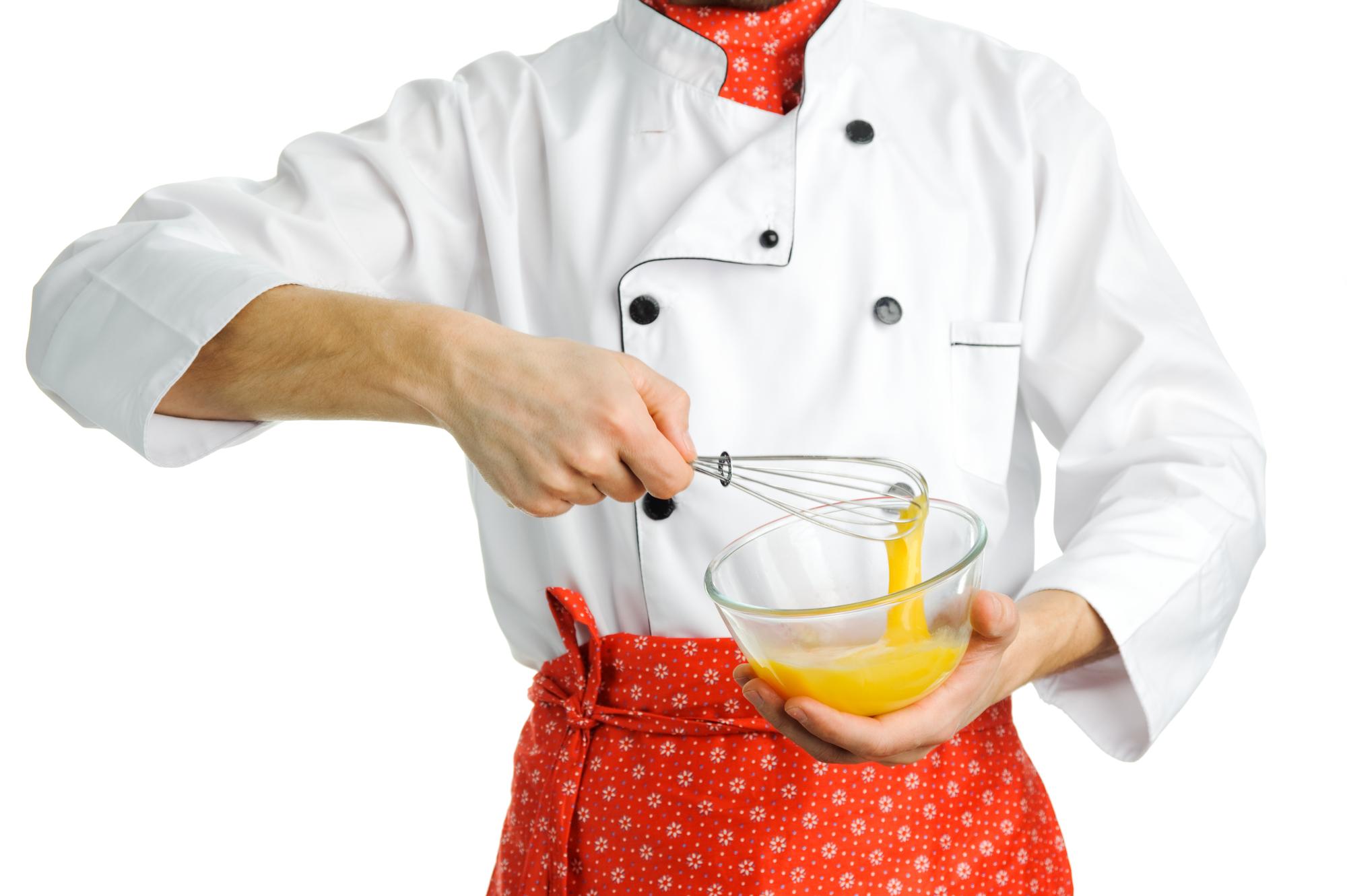 Close-up of hands finishing sauce with torch
